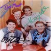 Cast photo autographed by 4